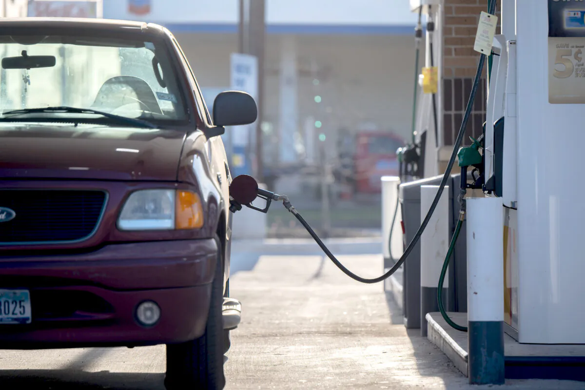 A gas pump is seen situated while pumping gas at a Shell gas station in Houston on April 1, 2022. (Brandon Bell/Getty Images)