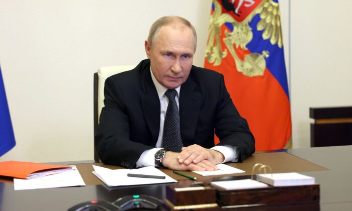 俄罗斯总统弗拉基米尔·普京于 2022 年 10 月 19 日在莫斯科郊外的新奥加廖沃州官邸通过视频链接主持安理会会议。（谢尔盖·伊林/人造卫星/法新社通过盖蒂图片社）
