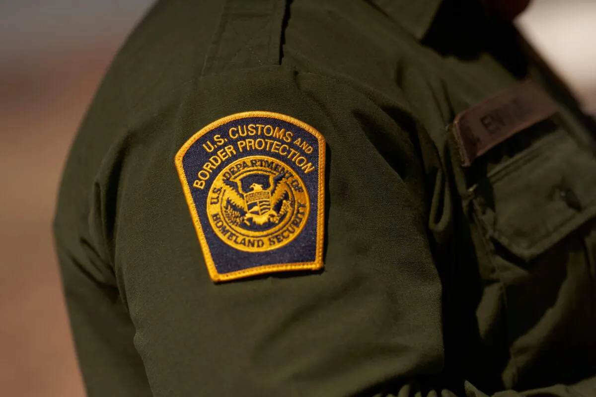 A U.S. Customs and Border Protection patch on the arm of an agent in the Jacumba mountains in Imperial County, Calif., on Oct. 6, 2022. (Allison Dinner/AFP via Getty Images)