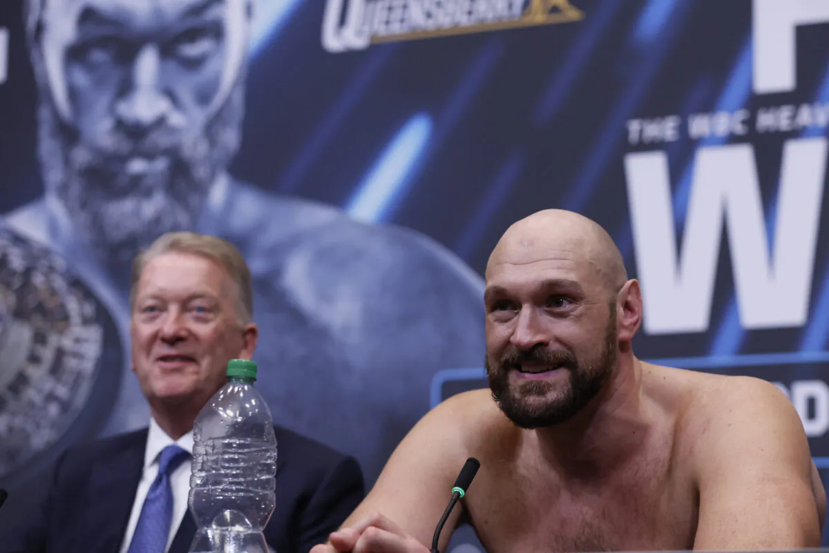 Tyson Fury (R) with promoter Frank Warren during a press conference after the WBC World Heavyweight Title fight in London on April 23, 2022. (Andrew Couldridge/Images via Reuters)