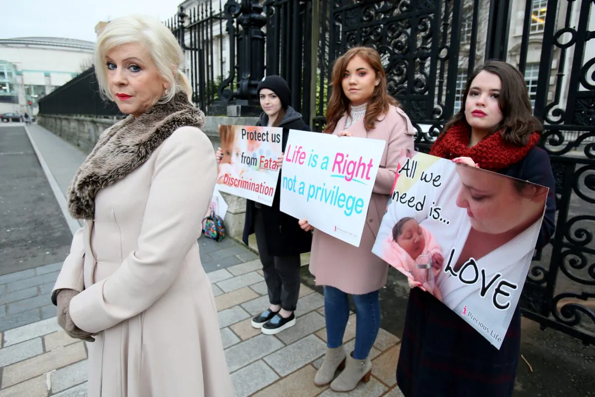Bernadette 'Bernie' Smyth (L), founder of pro-life campaign group Precious Life, stands with anti-abortion activists holding placards outside Belfast High Court, on Jan. 30, 2019. (Paul Faith/AFP/Getty Images)