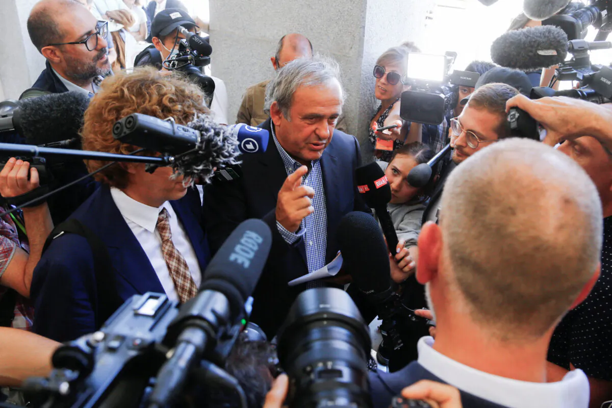 Former FIFA President Sepp Blatter speaks to the media after a trial at the Swiss Federal Criminal Court in Bellinzona, Switzerland, on July 8, 2022. (Arnd Wiegmann/Reuters)