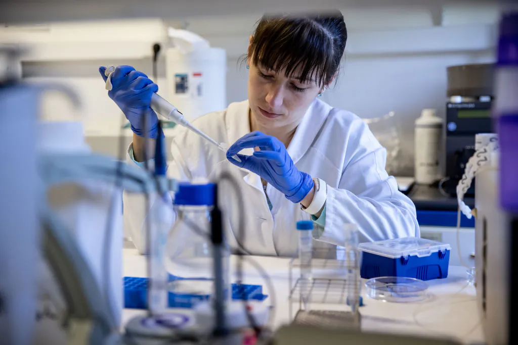 Biologist at SciCons works in the laboratory in Szirak, Hungary, on May 28, 2021. (Ajpek Orsi/Getty Images)
