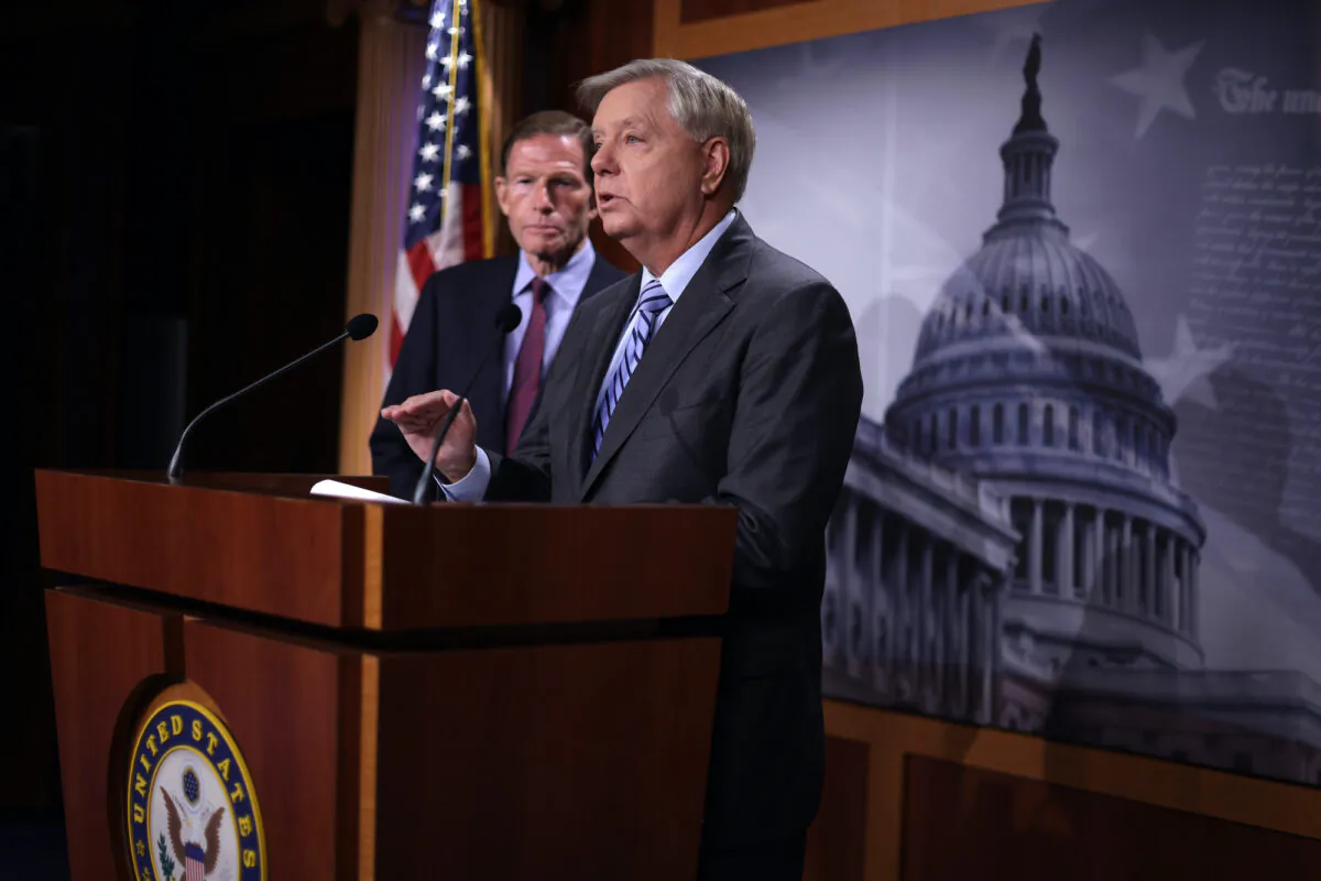 U.S. Sen. Lindsey Graham (R-S.C.) speaks as Sen. Richard Blumenthal (D-Conn.) listens during a news conference at the U.S. Capitol in Washington, on Sept. 29, 2022. (Alex Wong/Getty Images)