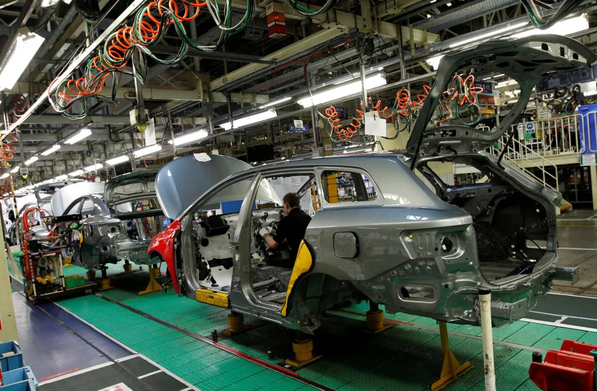 A man works on the production line at the Toyota factory in Derby, central England, on March 7, 2011. (Darren Staples/Reuters)