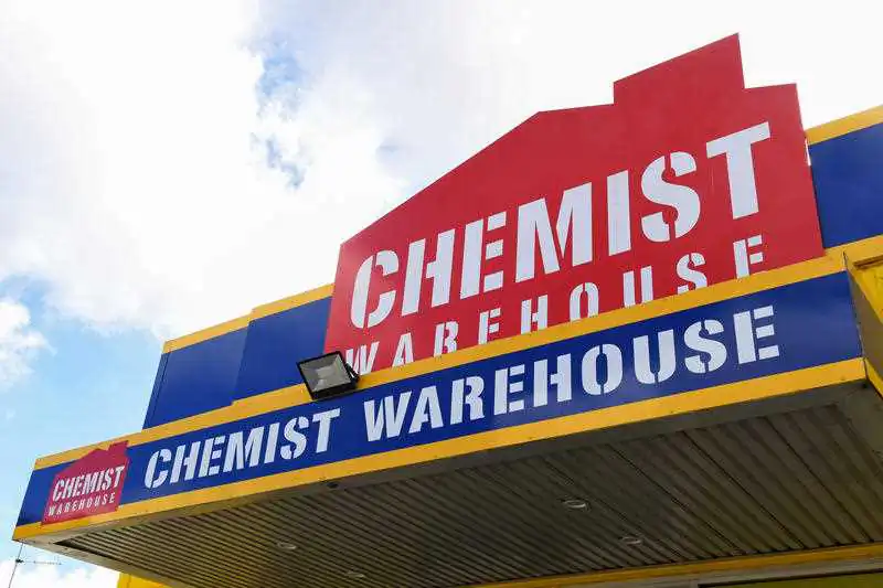 Signage is seen at the Chemist Warehouse store, at The Grove Liverpool shopping site, in Sydney, on Dec 2, 2021. (AAP Image/Bianca De Marchi)