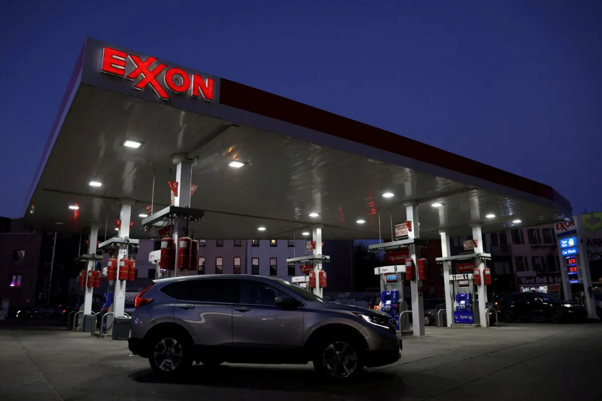 Cars are seen at an Exxon gas station in Brooklyn, New York City on Nov. 23, 2021. (Andrew Kelly/Reuters)