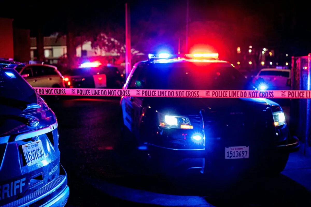 Police tape blocks off the crime scene in a file photo. (Andri Tambunan/AFP via Getty Images)
