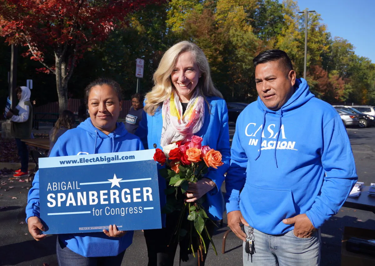 Silvia Ramirez (L), a member of CASA in Action, the political arm of the immigration rights non-profit, with Rep. Abigail Spanberger (D-Va.) in Woodbridge, Va., on Oct. 22, 2022. (Terri Wu/The Epoch Times)