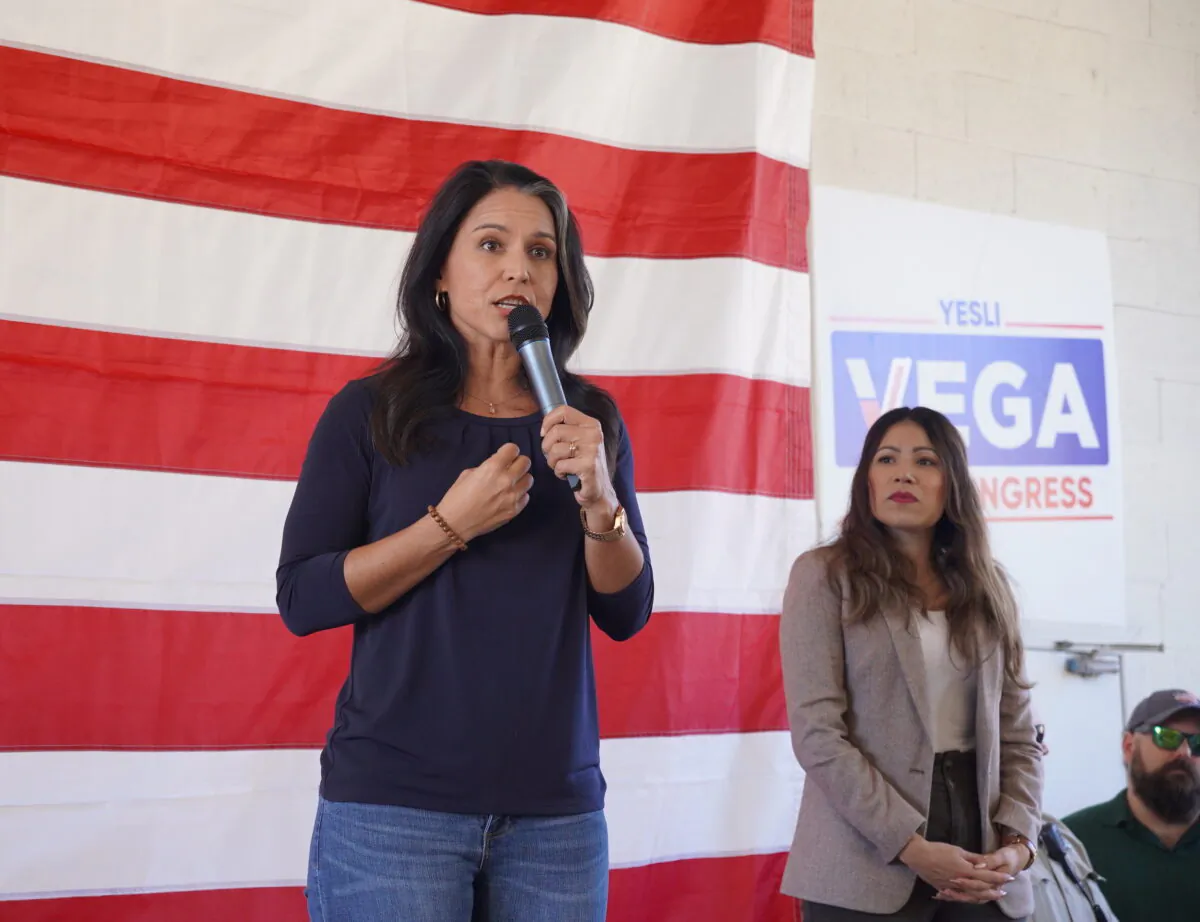 Former U.S. Rep. Tulsi Gabbard (L) speaks at a rally for Republican congressional candidate Yesli Vega (R) in Fredericksburg, Va., on Oct. 22, 2022. (Terri Wu/The Epoch Times)