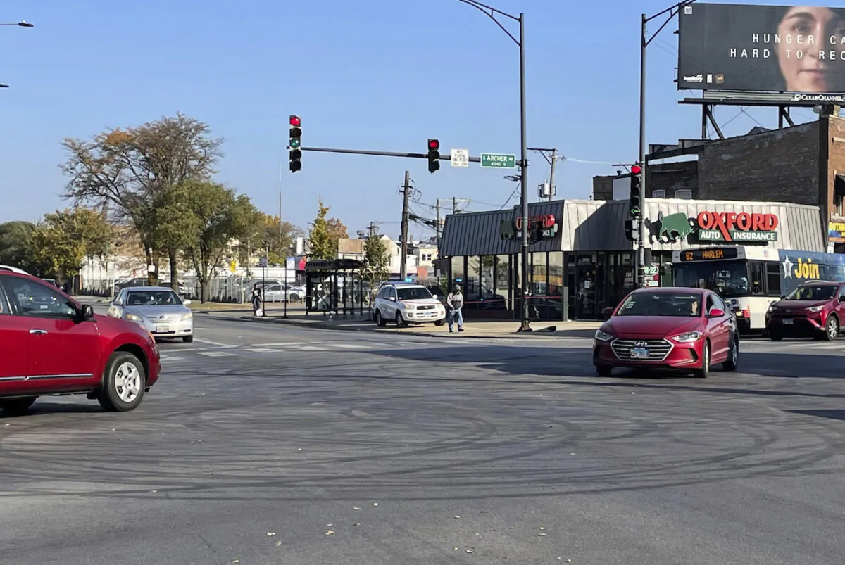 Tire marks from drifting in the intersection of Archer and Kedzie avenues in Chicago, where a shooting occurred early on Oct. 23, 2022. (David Struett/Chicago Sun-Times via AP)