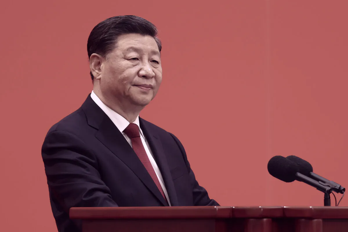 Chinese leader Xi Jinping speaks at the podium during the meeting between members of the standing committee of the Political Bureau of the 20th CCP Central Committee and Chinese and foreign journalists in Beijing on Oct. 23, 2022. (Lintao Zhang/Getty Images)