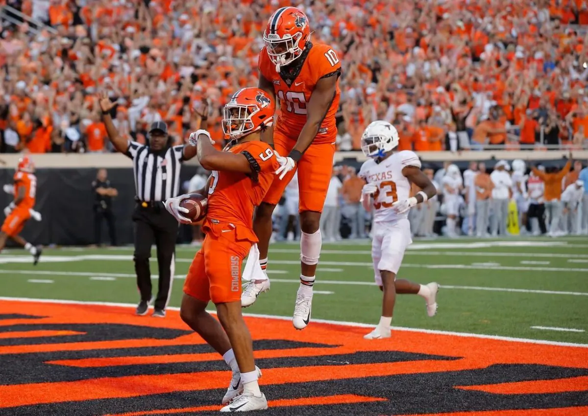 Oklahoma State receiver Bryson Green (9) celebrates beside receiver Rashod Owens (10) after scoring a touchdown in the fourth quarter of a 41–34 win against Texas at Boone Pickens Stadium in Stillwater, Okla., on Oct. 22, 2022. (Bryan Terry/THE OKLAHOMAN/USA TODAY NETWORK via Field Level Media)