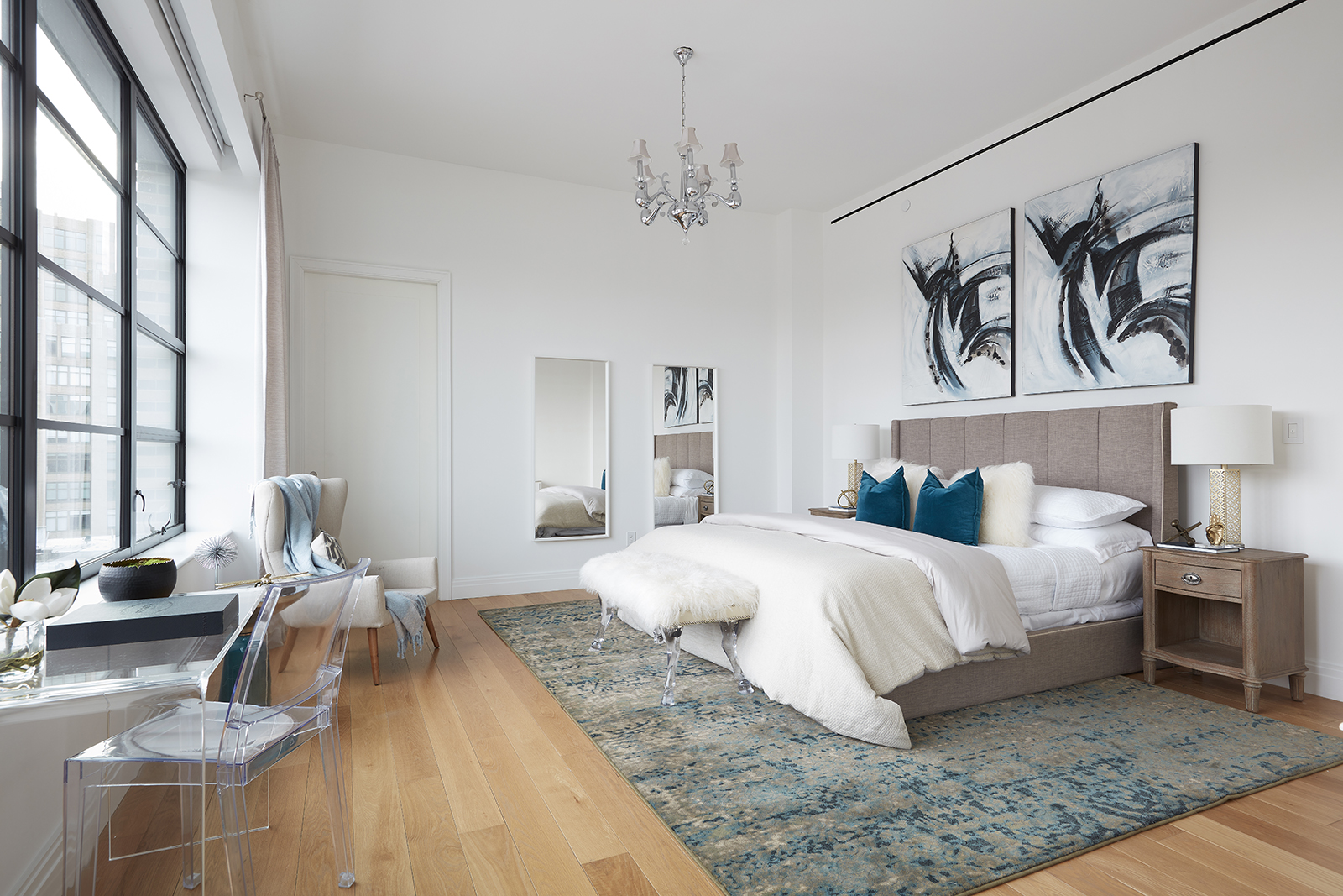 A faux fur bench adds a surprise element of texture to this bedroom.