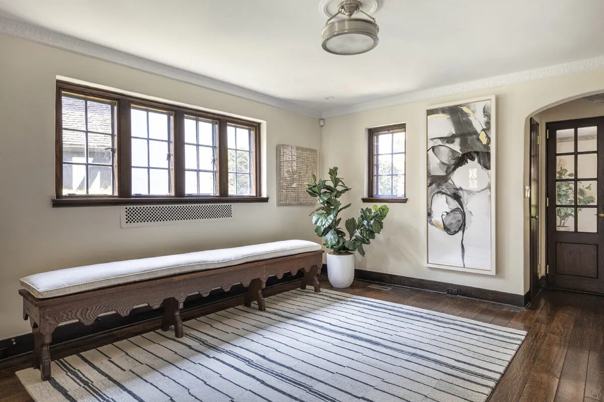 A hand crafted bench adds an element of grandeur to this home entry. (Handout/TNS)