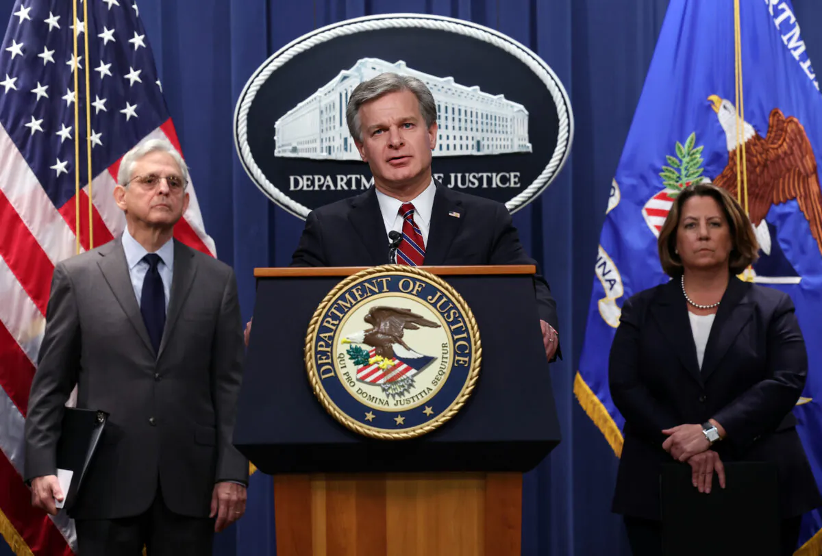 FBI Director Christopher Wray (C), Attorney General Merrick Garland, and Deputy Attorney General Lisa Monaco hold a press conference at the Department of Justice in Washington on Oct. 24, 2022. (Kevin Dietsch/Getty Images)