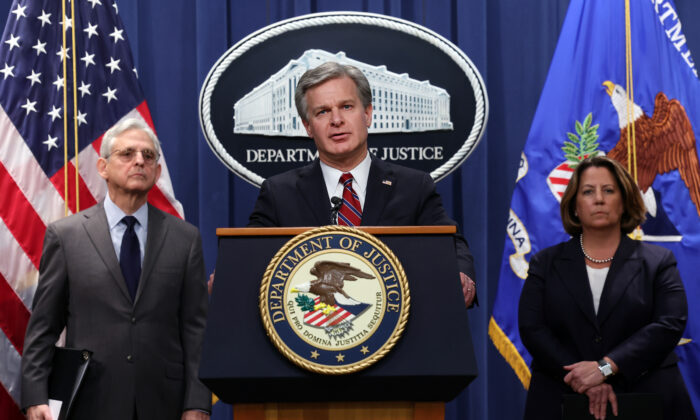 FBI Director Christopher Wray (C), Attorney General Merrick Garland, and Deputy Attorney General Lisa Monaco hold a press conference at the Department of Justice in Washington on Oct. 24, 2022. (Kevin Dietsch/Getty Images)