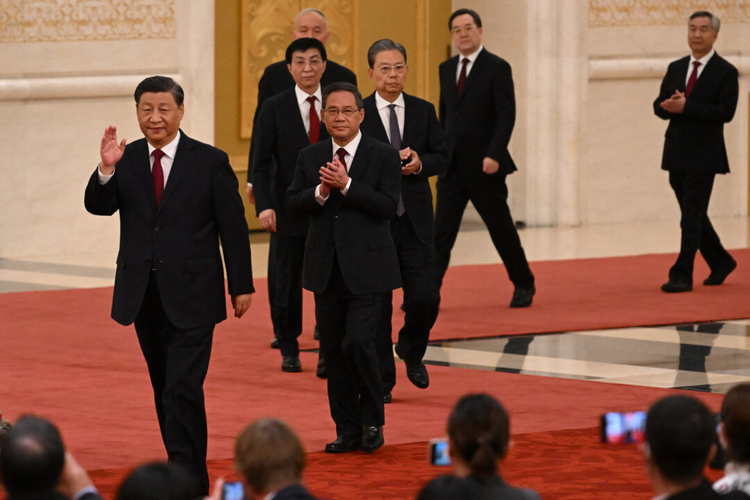 CCP leader Xi Jinping (front) leads members of the Party's new Politburo Standing Committee, the nation's top decision-making body, as they meet the media in the Great Hall of the People in Beijing on Oct. 23, 2022. (Noel Celis / AFP via Getty Images)
