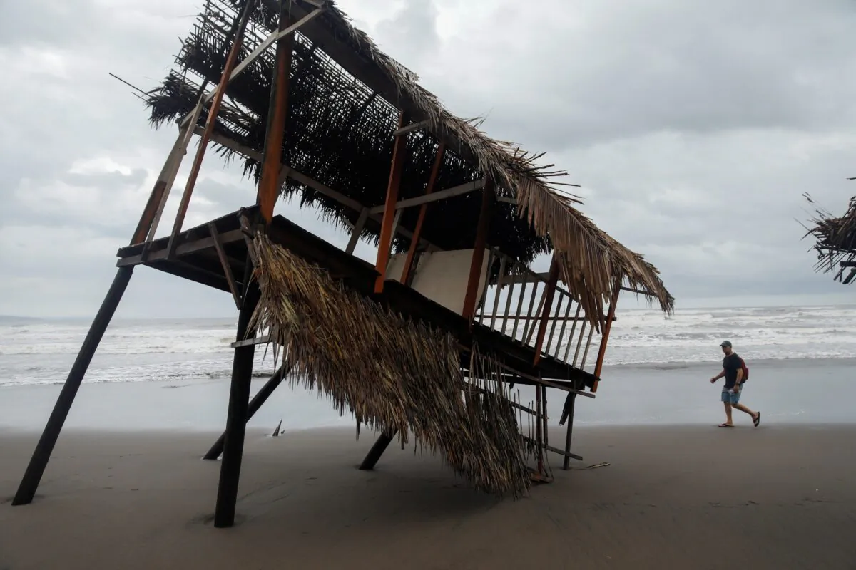 A palm leaf shade, known as palapa, damaged on the beach following the passing of Hurricane Roslyn that hit Mexico's Pacific coast with heavy winds and rain in San Blas in Nayarit state, Mexico, on Oct. 23, 2022. (Hugo Cervantes/Reuters)
