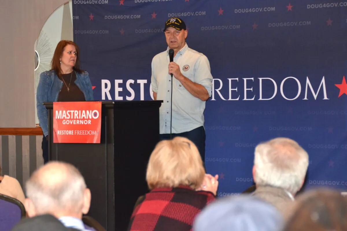 Republican nominee for Pennsylvania Governor Doug Mastriano campaigned in Luzerne, Pa., on Oct. 22, 2022. Left is his wife, Rebbie Mastriano. (Frank Liang/The Epoch Times)