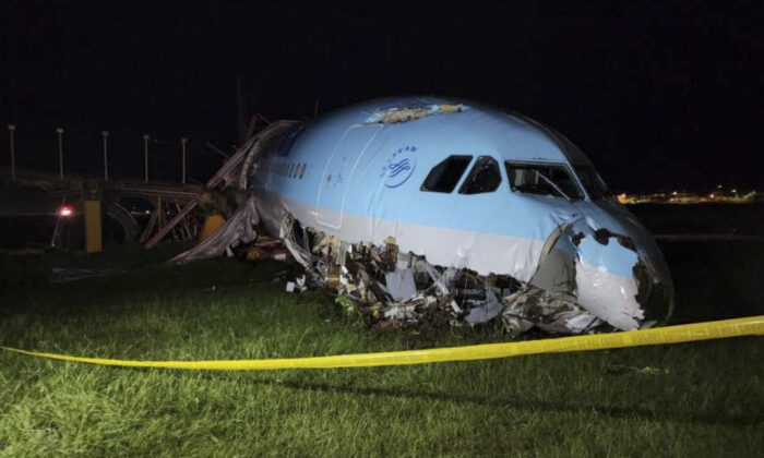A handout photo provided by the Civil Aviation Authority of the Philippines shows the damaged parts of a Korean Air plane lying after it flew over the runway at Mactan-Cebu International Airport in Cebu, central Philippines, Monday, October 24.  2022. (Philippine Civil Aviation Authority via AP)