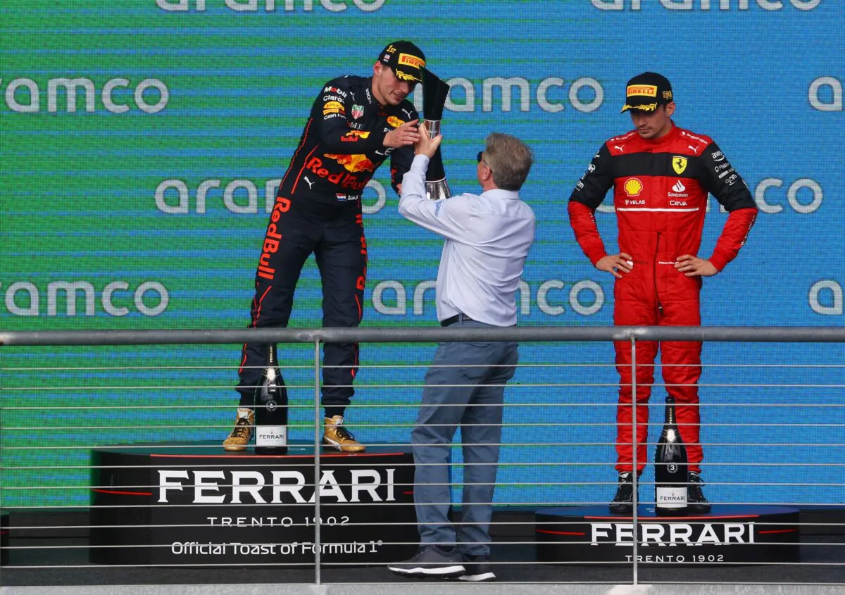 Red Bull's Max Verstappen celebrates on the podium after winning the United States Grand Prix with third placed Ferrari's Charles Leclerc in Circuit of the Americas, Austin, Texas on Oct. 23, 2022. (Mike Segar/Reuters)