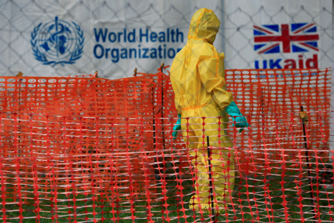 A person dressed in Ebola protective apparel inside an Ebola care facility at the Bwera general hospital near the border with the Democratic Republic of Congo in Bwera, Uganda on June 14, 2019. (James Akena/Reuters)