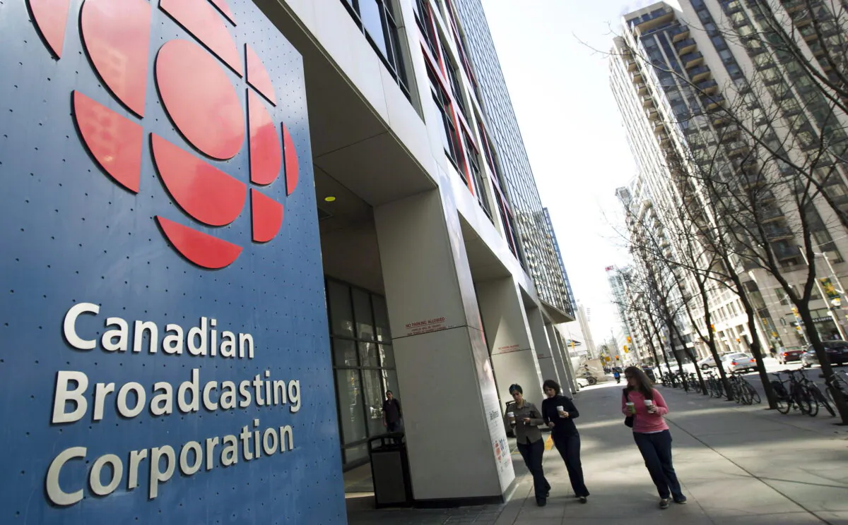 People walk into the CBC building in Toronto in a file photo. (The Canadian Press/Nathan Denette)