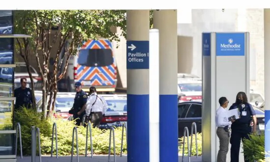 Official: Dallas Shooter Was Attending Birth at Hospital