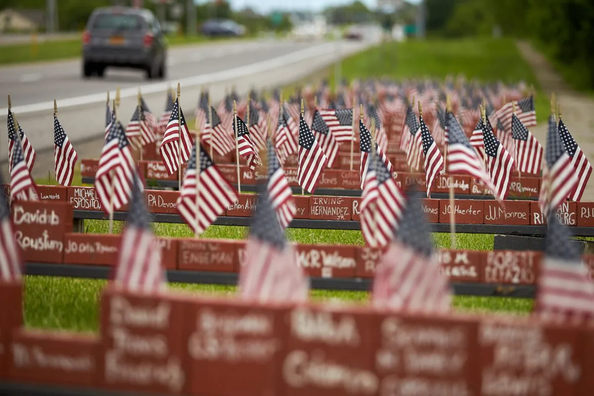 Cars pass by a memorial to American soldiers from New York State who were killed in Iraq or Afghanistan, near Canandaigua, N.Y., on June 4, 2019. Between 2008 and 2016, more than 6,000 veterans killed themselves each year, amounting to some 20 deaths a day, according to a 2018 report from the U.S. Department of Veterans Affairs (VA). (Geoff Robins/AFP via Getty Images)