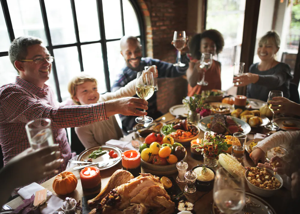 No matter what shape the economy is in, Thanksgiving is about family and friends gathering at the table to enjoy quality time together. (Rawpixel.com/Shutterstock)