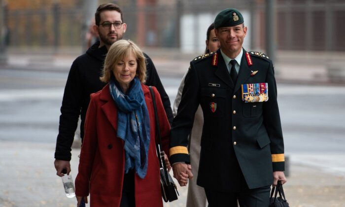 Maj.-Gen. Dany Fortin, right, arrives with his wife Madeleine Collin at a Gatineau, Que. courthouse on Oct. 25, 2022. (The Canadian Press/Spencer Colby)
