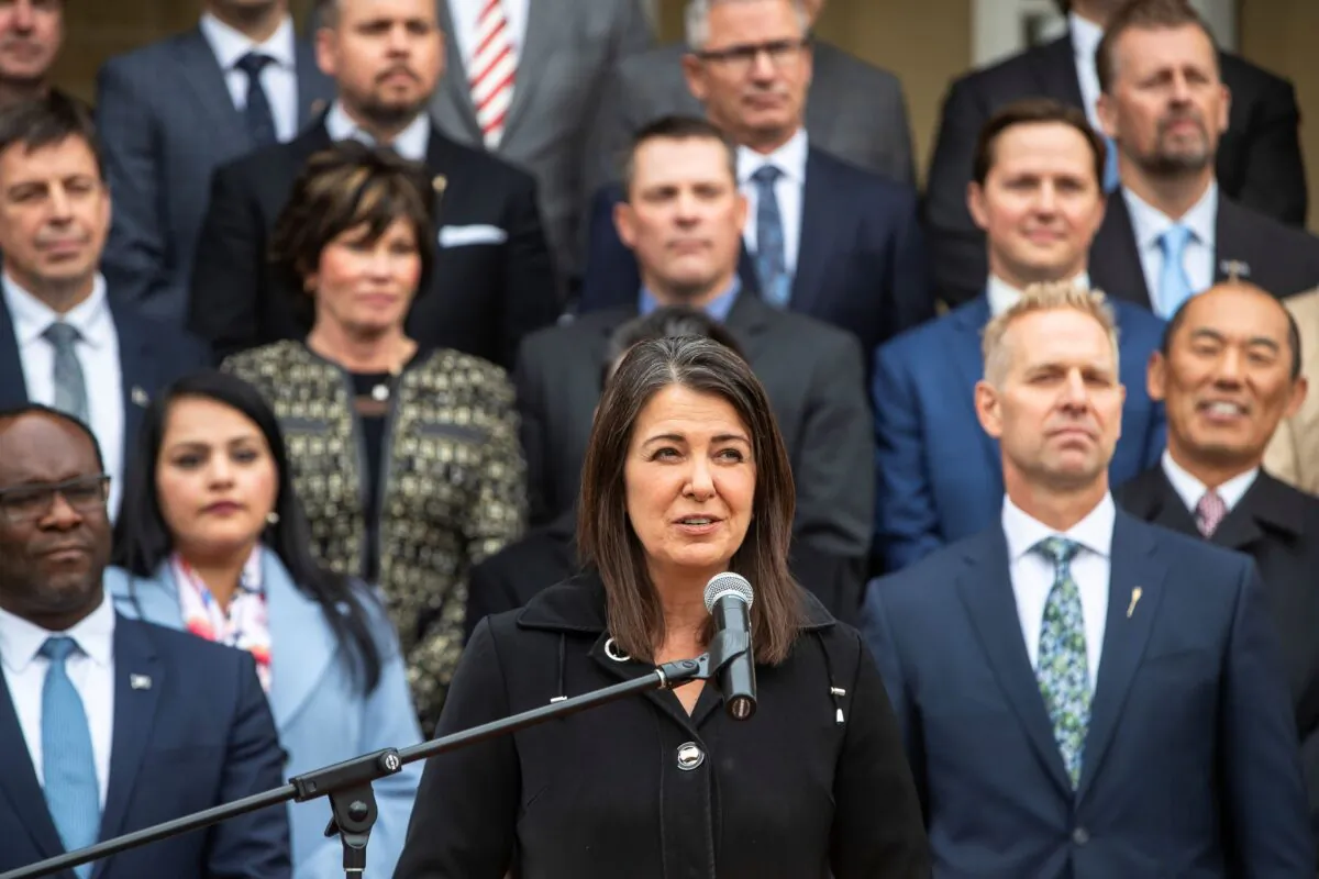 Alberta Premier Danielle Smith, along with cabinet ministers, speaks at a press conference after members were sworn into cabinet in Edmonton on Oct. 24, 2022. (Jason Franson/The Canadian Press)