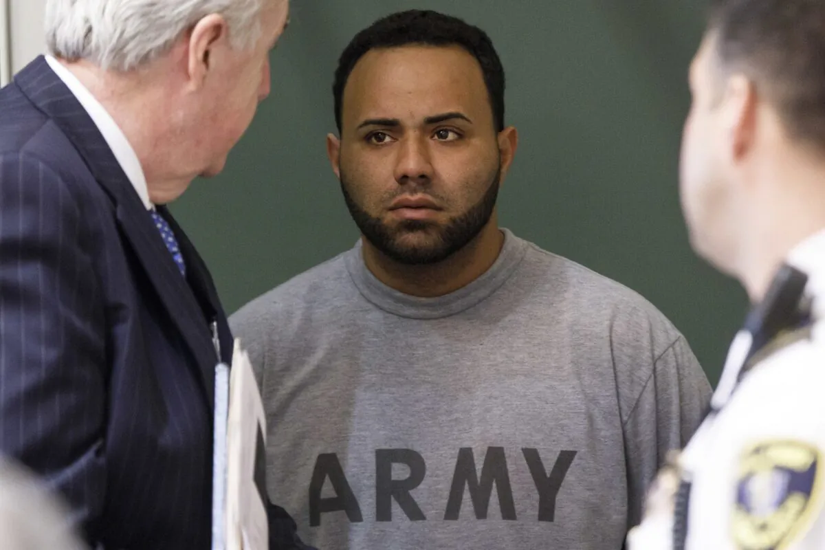 Angelo Colon-Ortiz (C) listens to his attorney Edward Ryan, Jr. (L) speak during his arraignment in connection with the assault and murder of Vanessa Marcotte in Princeton, Mass., last August at the Leominster District Court in Leominster, Mass., on April 18, 2017. (Keith Bedford/The Boston Globe via AP)
