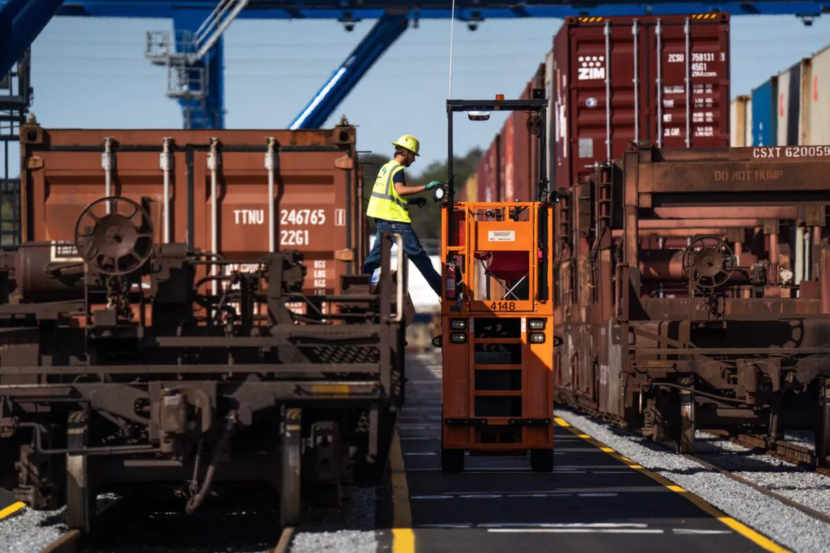 A worker tends to container loads at the Mason Mega Rail Station at the Garden City Port Terminal in Garden City, Ga., on Nov. 12, 2021. (Sean Rayford/Getty Images)