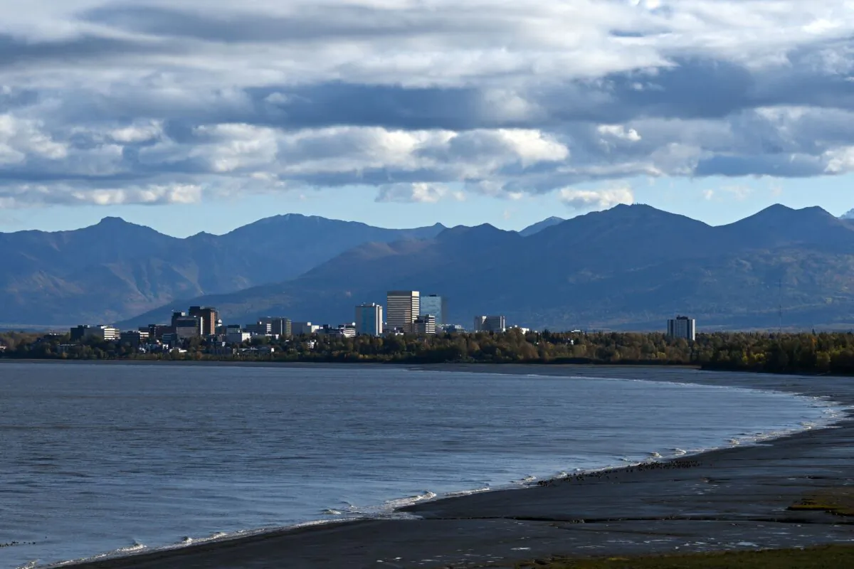 Clouds linger above the Chugach Mountains and downtown Anchorage as seen from across the waters of the Knik Arm at Earthquake Park in Anchorage, Alaska on Sept. 17, 2022. (Patrick T. Fallon/AFP via Getty Images)