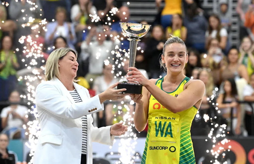 Liz Watson of Australia and Coach Stacey Marinkovich hold up the Constellation Cup after the Constellation Cup match between the Australia Diamonds and New Zealand Silver Ferns at Gold Coast Convention and Exhibition Centre in Gold Coast, Australia, on Oct. 23, 2022. (Bradley Kanaris/Getty Images)