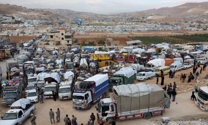 Syrian refugees prepare to return to Syria from Wadi Hmayyed, on the outskirts of the Lebanese border town of Arsal, Lebanon, on Oct. 26, 2022. (Mohamed Azakir/Reuters)