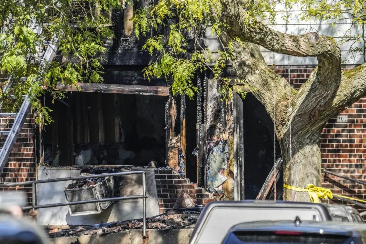 An apartment building is damaged after a fire in Hartland, Wis., on Oct. 21, 2022. (Scott Ash/Milwaukee Journal-Sentinel via AP)