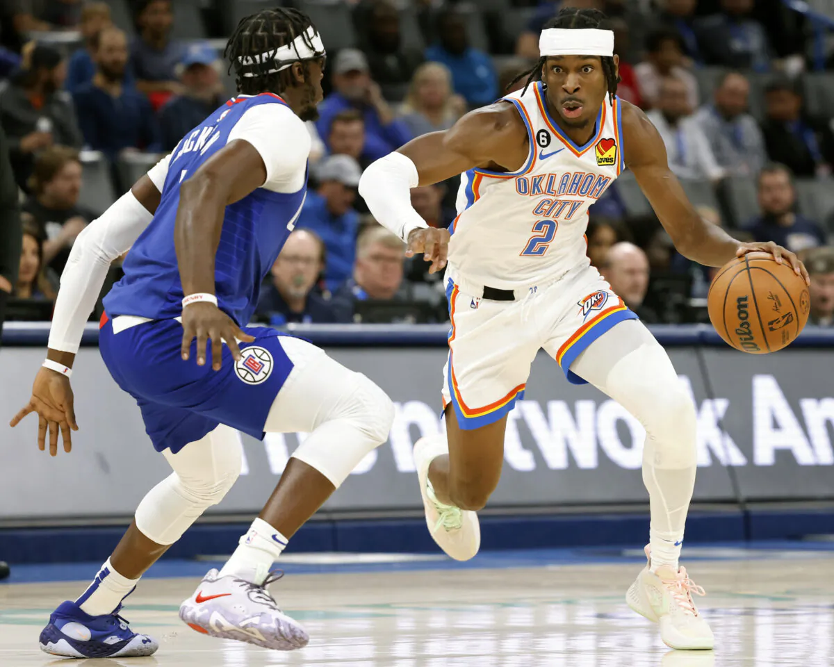 Oklahoma City Thunder guard Shai Gilgeous-Alexander (2) drives the ball against Los Angeles Clippers guard Reggie Jackson (1) during the first half of an NBA basketball game, in Oklahoma City, on Oct. 25, 2022. (Garett Fisbec/AP Photok)