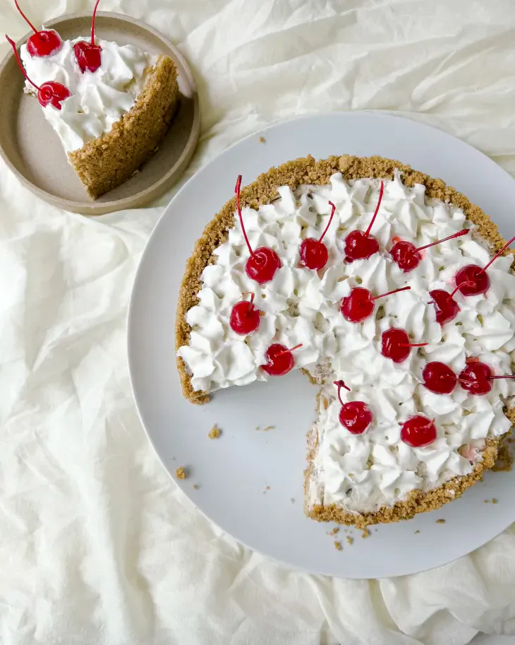 This retro pie pairs a crunchy graham cracker crust with a rich, creamy filling studded with sweet pineapple, toasted pecans, and coconut. (Sahara Bohoskey/TNS)