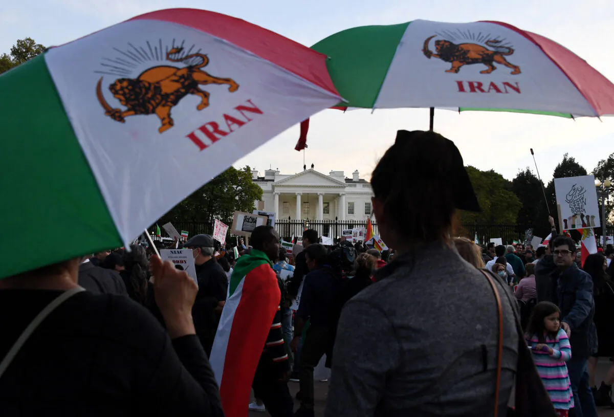 Protesters march in solidarity with protesters in Iran in front of the White House in Washington on Oct. 22, 2022. (Olivier Douliery/AFP via Getty Images)