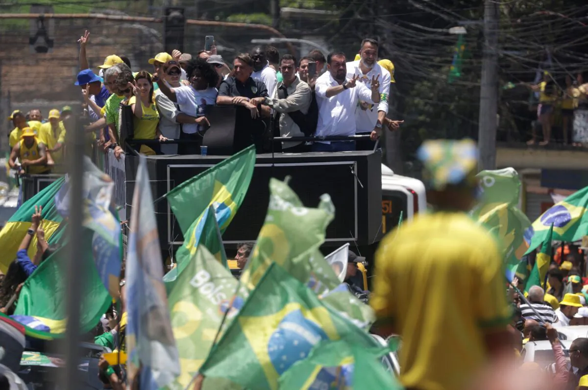 Brazil's president and candidate for reelection Jair Bolsonaro leads a motorcade in Belford Roxo, near Rio de Janeiro, Brazil, on Oct. 27, 2022. (Ricardo Moraes/Reuters)