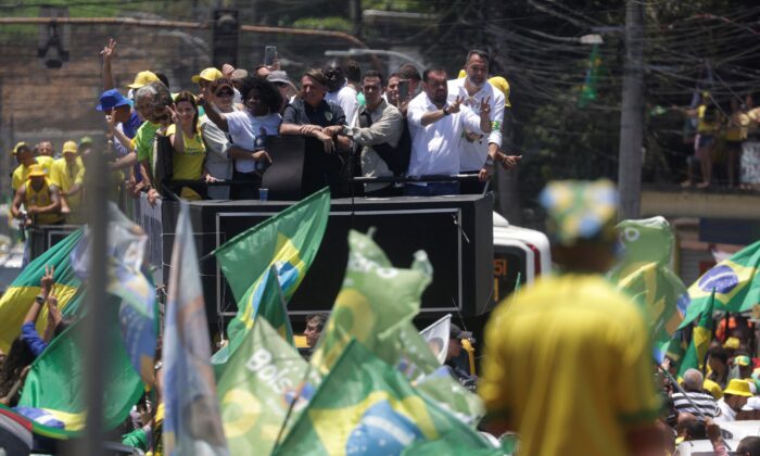 Brazil's president and candidate for reelection Jair Bolsonaro leads a motorcade in Belford Roxo, near Rio de Janeiro, Brazil, on Oct. 27, 2022. (Ricardo Moraes/Reuters)