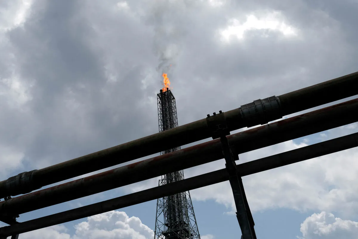 A tower flaring gas at an LNG processing plant operated by Shell and others in Bonny Island, in Rivers state, Nigeria on June 21, 2017. (Paul Carsten/Reuters)