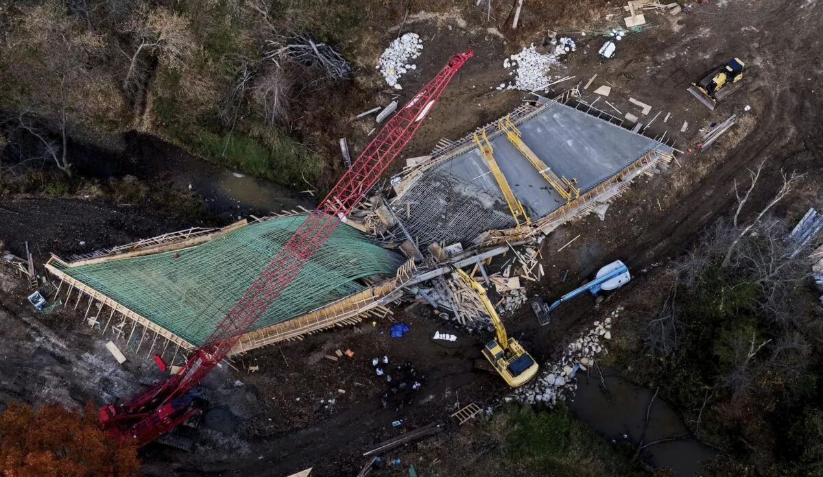 Responders gather at a bridge under construction after it collapsed in rural Clay County near Kearny, Mo., on Oct. 26, 2022. (Rich Sugg/The Kansas City Star via AP)