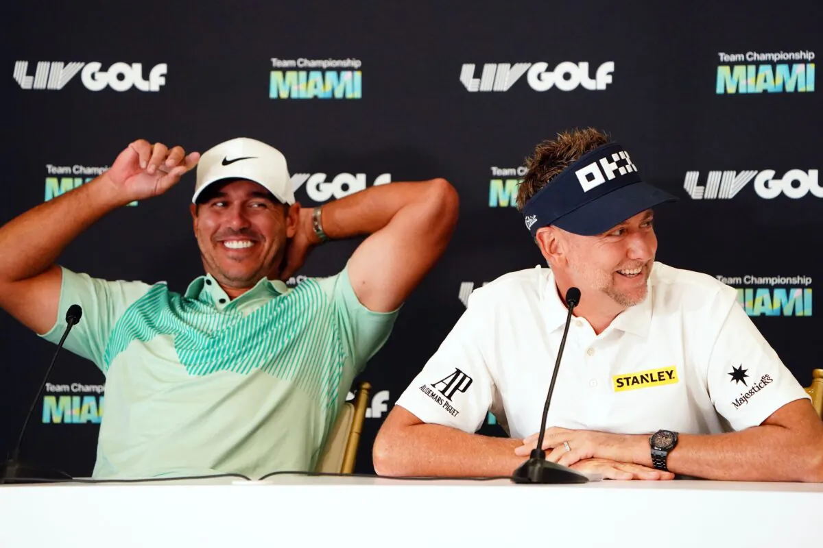 Brooks Koepka (L) and Ian Poulter share a laugh during a press conference before the LIV Golf series at Trump National Doral in Miami on Oct. 26, 2022. (John David Mercer/USA TODAY Sports)
