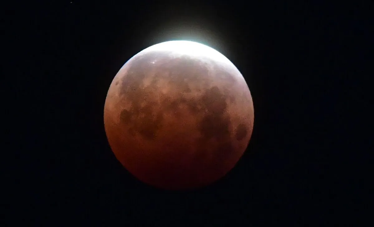 The "Super Blood Moon" total eclipse seen over Santa Monica, Calif., on May 26, 2021. (Frederic J. Brown/AFP via Getty Images)