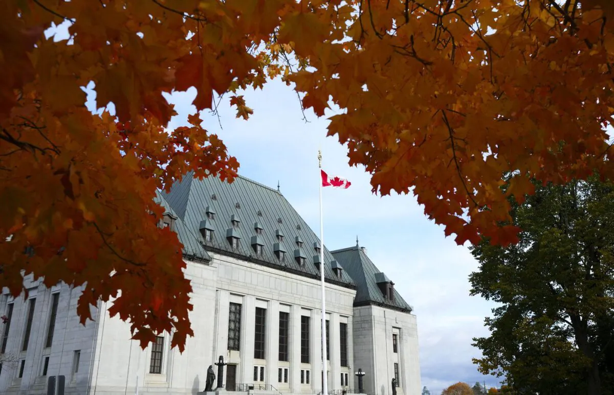 The Supreme Court of Canada is pictured under fall coloured leaves in Ottawa, on Oct. 20, 2022. (The Canadian Press/Sean Kilpatrick)