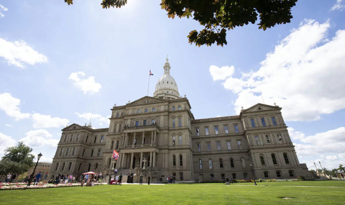 People attend a Rally The Vote event at the Michigan State Capitol in Lansing on July 30, 2022. (Bill Pugliano/Getty Images)